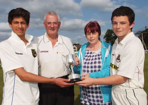 Thelma Colhoun, chairperson, and David Caldwell, secretary of the Derry Mid-Week Cricket League, pictured with Varun Chopra, captain of Coleraine, and Bready captain, James Colhoun, before the Derry Mid-Week Under-14's KO Cup final at Eglinton. INLS2813-164KM