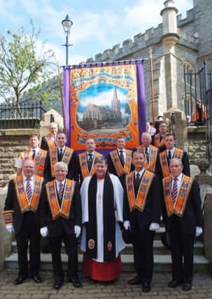 Officers of the City of Londonderry Grand Orange Lodge pictured with their new banner and collarettes which were dedicated during a service in St. Columb's Cathedral on Sunday. Included is the Very Rev Dr. William Morton, Dean of Derry. INLS2813-149KM