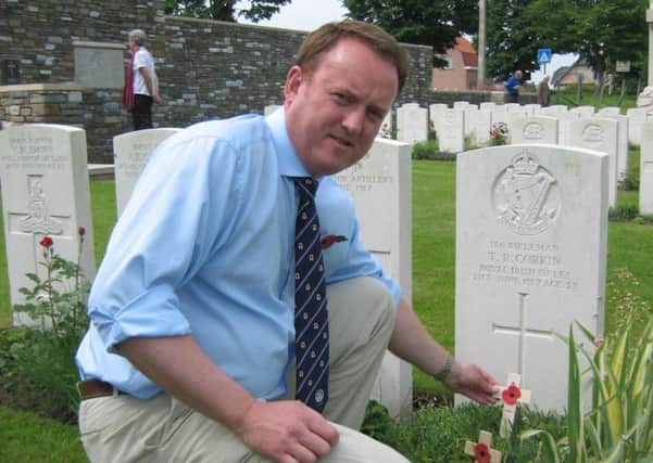 Deputy Mayor Colin McCusker at the grave of his cousin Thomas Corkin who was killed in Belgium during the First World War INLM28 004