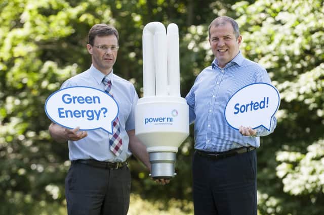 Philip Thompson, director of environmental services at Larne Borough Council is pictured with Alan Egner of Power NI. The company has won a contract to supply Larne Council with renewable energy for the next 12 months.INLT 28-691-CON