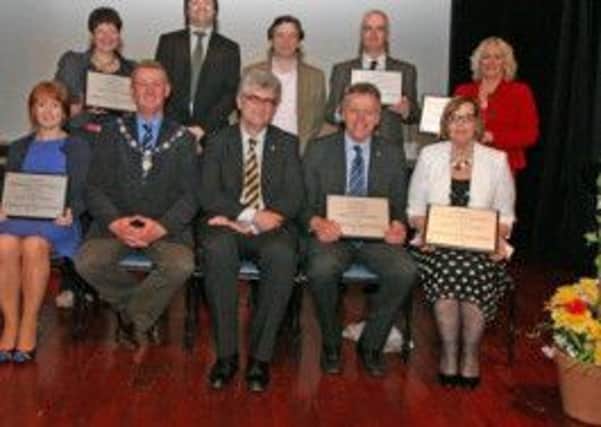 SHARE. Pictured at Dalriada School on Wednesday night for the SEP - Shared Education Programme- final celebration along with Deputy Mayor Cllr Ian Stevenson, Prof Gallagher ( front centre, Queens University), A. Stewart and M.Baxter (also from Queens, back row 2nd and 3rd from left) are local school Principals with their inscribed plaques. They are S. Stewart (Sandelford), Malachy Conlon, (St Brigid's Ballymoney), Vivien Moorhouse (Leaney). Front, J. Jamieson, (Model Intergrated), Tom Skelton (Dalriada) and Maire Buckley (Our Lady of Lourdes).INBM27-13 052SC.