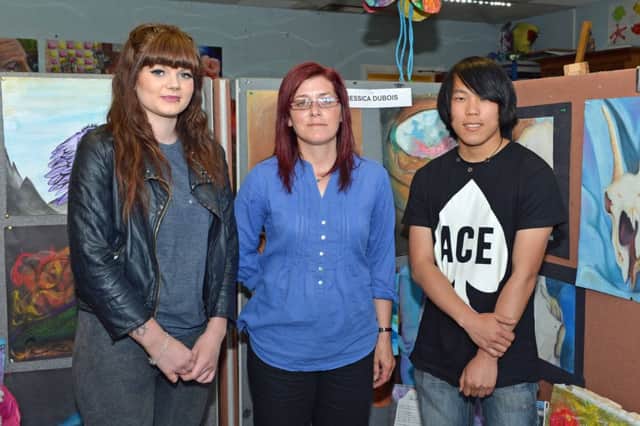 Jessica Dubois,Jenny Sharratt and Bochao Chen are pictured at the Northern Regional College end of year Art,Design and Creative Studies show. INNT 27-021-PSB