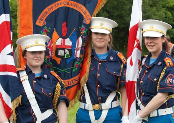 Rebecca Taylor, Stephanie Rowe and Nichola Robinson made up the colour party for the Pride of the Orange & Blue Flute Band, Newbuildings, in Rossnowlagh on Saturday. INLS2813-115KM