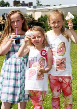 Lucy Smyth, Holly Erskine and Porscha Erskine enjoying a cool drink and an ice cream in the sunshine. INBT29-215AC