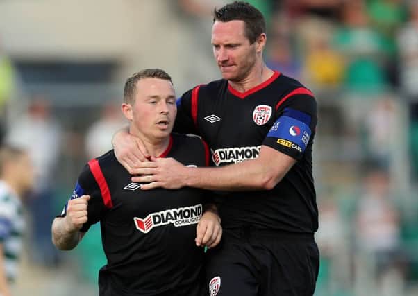 Derry City's 
Michael Rafter celebrates with Barry Molloy, after slotting home his penalty, at Shamrock Rovers, on Friday night.