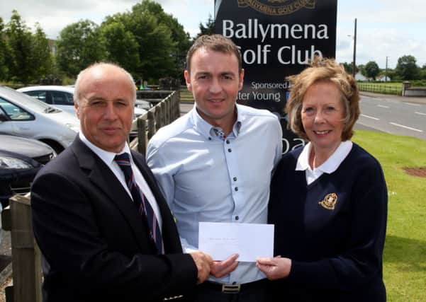 Philip McBurney, of McBurney Transport who are sponsoring the open week at Ballymena Golf Club, is pictured presenting a cheque to Jim Drennan (Captain) and Marion Boland (lady vice-captain). INBT28-234AC
