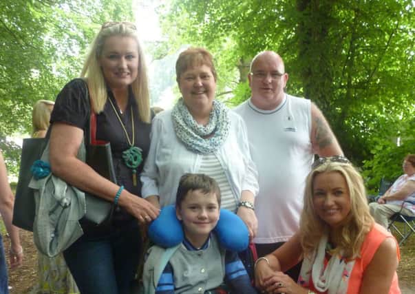 Soaking up to atmosphere at the Demesne in Scarva, Ulster Unionist MLA Jo-Anne Dobson and her sister Belinda Dale with Banbridge family Carol and Davy Cully and their young Matthew.