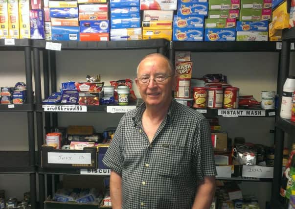 Alan Turner, Larne foodbank co-ordinator, pictured with some of the donated items stored at Craigyhill Mthodist Church.  INLT 29-680-CON