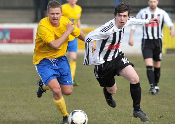 Institute's new signing Gary Henderson (right), tussles with 
Bangor's Andy Morrow while playing for Dergview
 last season.