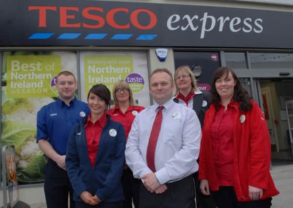 The manager of the Tesco Metro in Larne, Mark Waring, with some of the staff at the opening on Tuesday. INLT 29-445-PR