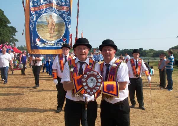 Bruce Kidd and Ray McCoy of Dollingstown LOL No. 62 with the trophy for Best Lodge and Band on parade in Loughbrickland.