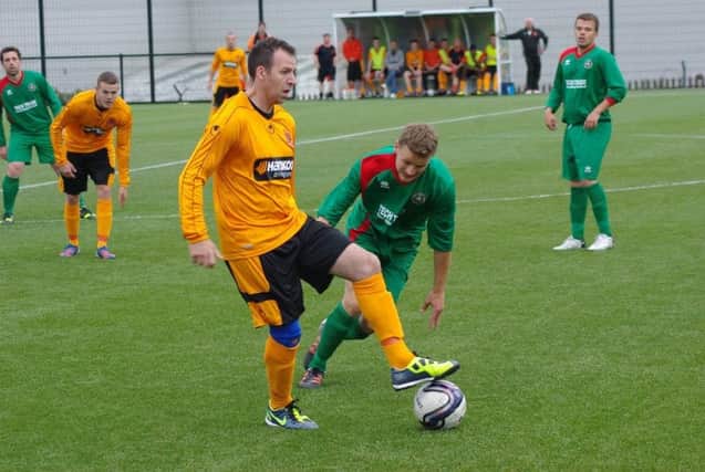 Damien Curran on the ball for Carrick Rangers in last night's 1-1 draw with Larne Tech OB.