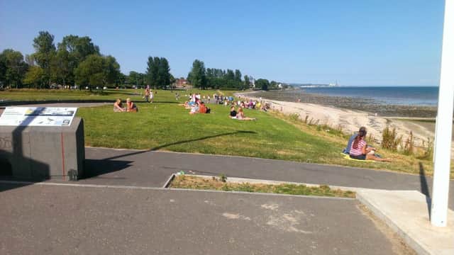 Local people enjoying the sun at the Loughshore. INNT 30-600con