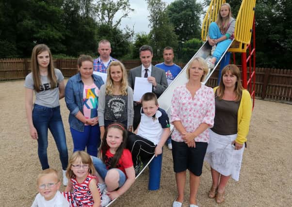 Paul Frew MLA was joined by local parents and children at the Knockan Road Childrens Play Park in Broughshane at last week's launch of a petition to improve the facilities in the park. INBT 30-102JC