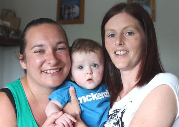 Lyn Patton and Mandy Jones with little Luke who celebrates his first birthday in August. INLM30-Charity