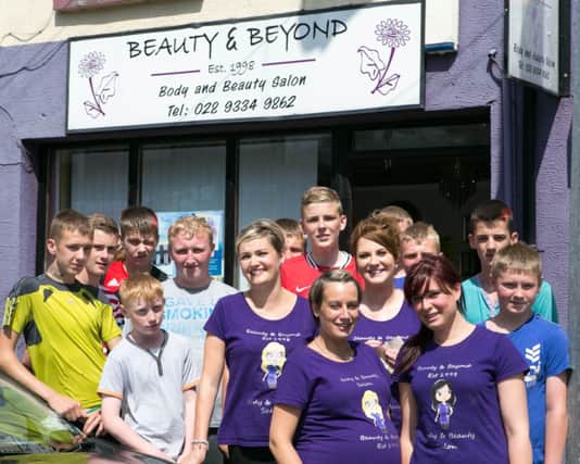 Staff from Beauty & Beyond in Ballyclare with the boys from Grange Community Football Club. INNT 30-424-RM