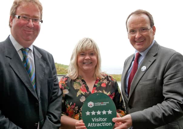 The Giant's Causeway Visitor Centre has been awarded a 5 Star Classification by the Northern Ireland Tourist Board.Max Bryant and Esther Dobbin, National Trust, are presented with the accolade by Howard Hastings, Chairman of the Northern Ireland Tourist Board. INBM31-13