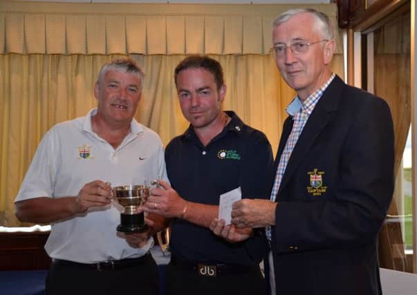 Winner of the Junior Scratch Cup at North West Club, Sean McLaughlin pictured with Gary McLaughlin (Total Golf Europe, sponsors) and Mr Captain, John McGinley.