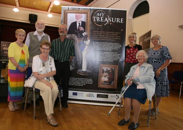 MEMORIES. Pictured at Coleraine Town Hall for the opening of the 'Memories Exhibition' on Monday are John Hamilton, Causeway Museum Services, Maria Cagney, Mid-Antrim Museum Services along with ladies and gentlemen - some who had items on display.CR31-300SC