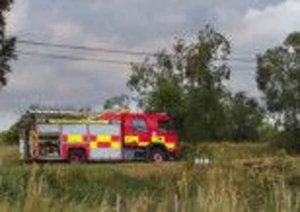 Fire engine close to the scene of the hay shed fire at Derryvaren Road INTT3113-600OC