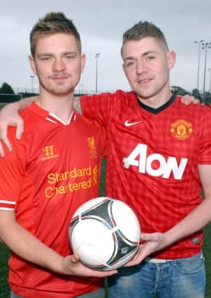 Brothers Josh McCrory and Lewis Boyd who are organisig a charity football match in aid of Macmillan Cancer Support between the Ballee Liverpool and Manchester United supporters at Ballymena Showgrounds on the 9th August. INBT28-220AC