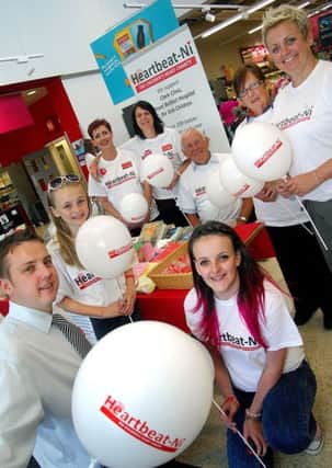 Photographed with Ballymena Sainsbury store staff for the launch of their yearly charity "Heartbeat-NI" were wee Nicola, Sadie Peachey, Claire Caulfield, Shealyn Caulifield, Paul Carr, Deputy Manager, Michelle McGillian, Michele Moore and George Caulfield. INBT 31-932H