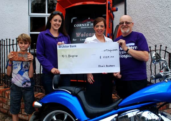 The Corner House Bar and The Blues Brothers have raised £2,115.50 for the N.I Hospice Buy a Brick Appeal.  Pictured left-right: Caolan McConville, Deirdre Melly, Northern Ireland Hospice Community Fundraiser, Roisin McCann, Proprietor of The Corner House Bar and Paul McConville INLM31 010