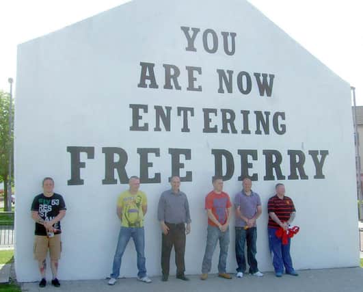 Some of the Newtownabbey group pose for a picture in front of one of the Bogsides most famous landmarks. INNT 31-101CON