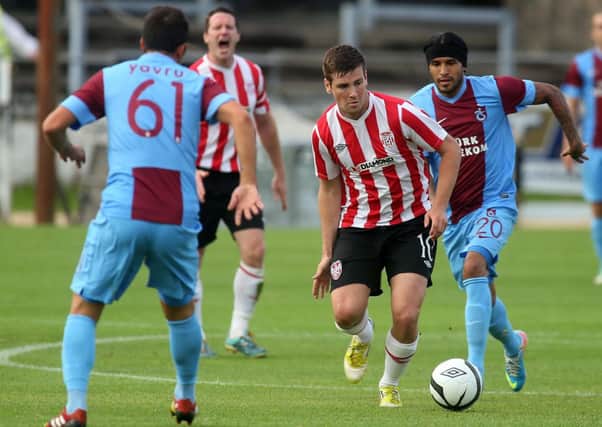 Derry City's Patrick McEleney runs at Trabzonspor duo Zeki Yavru and Gustavo Colman, during their recent Europa League game.