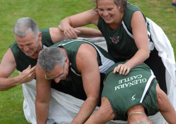 Glenarm rowing Club take a tumble during the Wipeout competition. INLT 30-347-PR