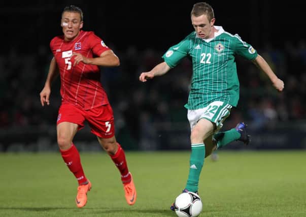 Northern Ireland's Shane Ferguson races away from Luxembourg's Tom Schnell during their World Cup Qualifier at Windsor Park.