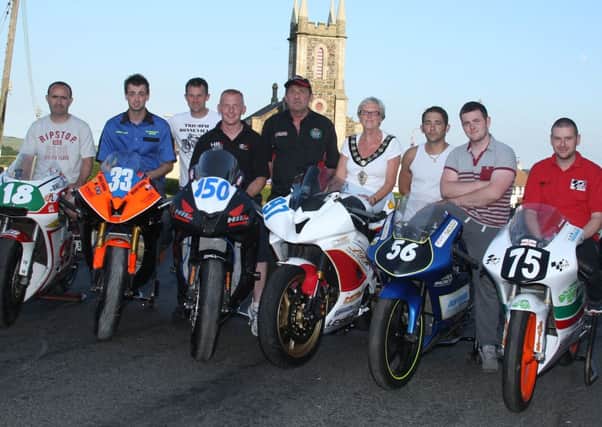Clerk of the Course Raymond Aitcheson, pictured with Ballymenas new Mayoress of Ballymena, Cllr. Audrey Wales MBE and some of the riders who will compete in the Mid-Antrim 150 road races at Clough this weekend. Picture: Roy Adams.