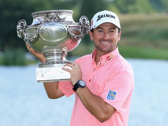 PARIS, FRANCE - JULY 07:  Graeme McDowell of Northern Ireland poses with the trophy after victory in the final round of the Alstom Open de France at Le Golf National on July 7, 2013 in Paris, France.  (Photo by Richard Heathcote/Getty Images)