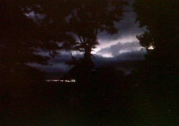A lightening strike on Thursday night illuminates the River Foyle.