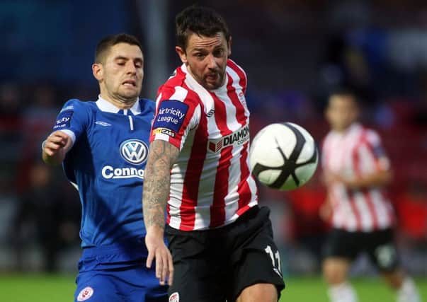 Derry City's Rory Patterson races away from Sligo Rovers defender Seamus Conneely.