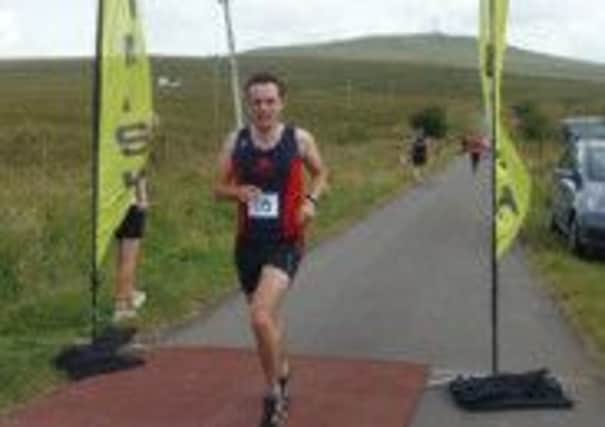 Seapark's Ian Clelland crossing the line at the Divis Mountain 10k.