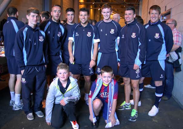 Local lads Aaron and Michael with some of the BUFC players at the open event in the Showgrounds complex on Saturday. INBT 32-923H