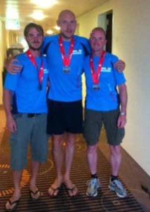 Ryan Rainey, Philip Castles and Phil McDonald who took part in the Ironman Switzerland competiiton. INLM32-208