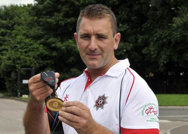Mark Montgomery with his gold medal from the World Police and Fire Games. INLM32-114gc