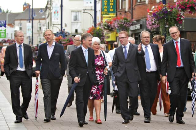 Finance Minister Simon Hamilton, third from the right, taling a walk in Coleraine town centre with members of the Causeway Chamber of Commerce, Coleraine Borough Council Executives and local traders after  addressing local businesses on rates revaluation at Coleraine Borough Council Offices.