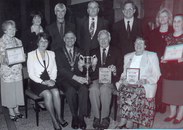 The Deputy Mayor Joe Miller presenting Norman Campbell with the Age Concern Pensioner of the Year Award in 1997.