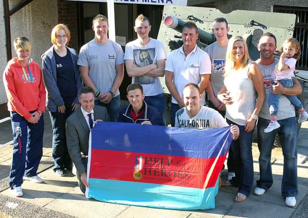 Friends sky-diving for "Help For Hero's" photographed outside the Ballymena Services Club where they received support from Ballymena's Paul Frew, MLA; and Philip Gillespie, ex-RIR. INBT 33-812H