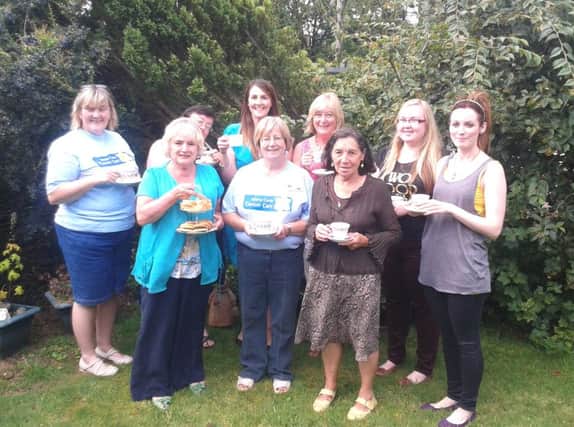 Members of Muriel's North Belfast and Newtownabbey Fundraising Group and some of the ladies who attended the tea party. INNT 33-501CON