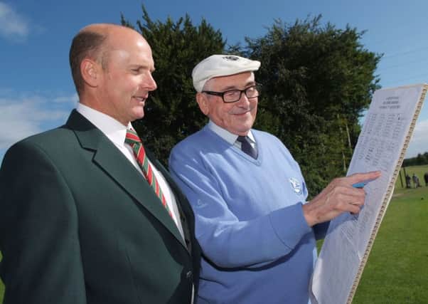 Terry Dornan, left, Club Captain, chatting to official starter, Don O'Doherty, on the first tee, during his Captain's Day competition at Faughan Valley Golf Club. INLS3213-117KM