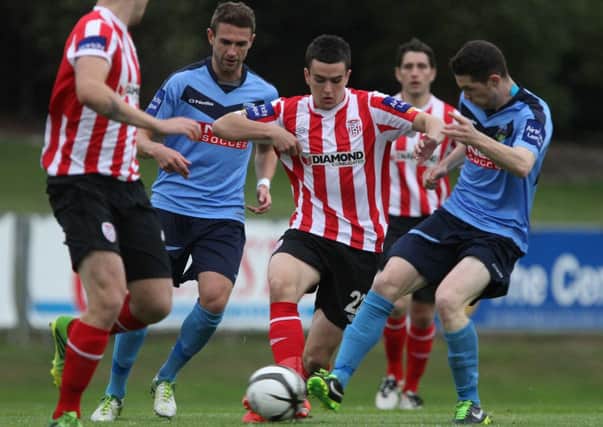 Derry City's Michael Duffy competes with UCD's Cillian Morrison and Robbie Creevy. Pics by Ed Scannell