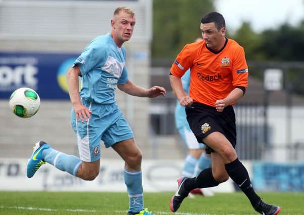 Glenavon's Mark Farren and Ballymena's  Johnny Taylor tussle for possession. Picture: Press Eye.