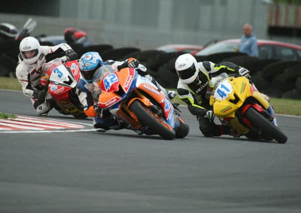 Luke Johnston (42) from Ahoghill ahead of Dundrod's Robert Kennedy (41) and Joe Loughlin (3). Picture: Roy Adams.