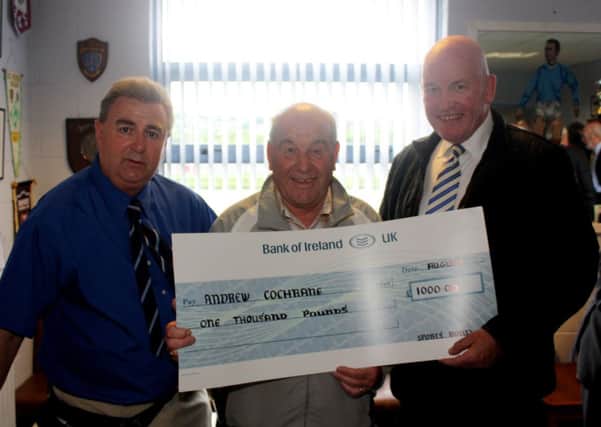 Drew Cochrane receives his £1,000 Sports Bond jackpot cheque at Saturday's match from promoter Brian Thompson and Glenavon chairman Adrian Teer. Picture: Reid McAuley.
