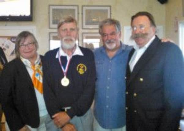 Geoff Alcorn (second from left) was presented with his sailing medallion by Mayor Harry Winthrop in the Newport Yacht Club's lounge.  Pictured beside Geoff is Commodore Lauren Anton, Past Commodore Norm Bailey and Newport Mayor Harry Winthrop.  INCT 33-727-CON
