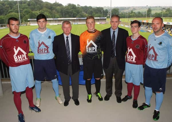 Billy Henderson, third from left, of Billy Henderson Properties, handing over new home and away soccer strips to Institute Football Club at the Riverside Stadium. Included are Keith McElhinney, club chairman, and from left, Aaron Walsh, Darren McFadden, Nathan Gartside,Gary Henderson and Paddy McLaughlin. INLS3313-207KM